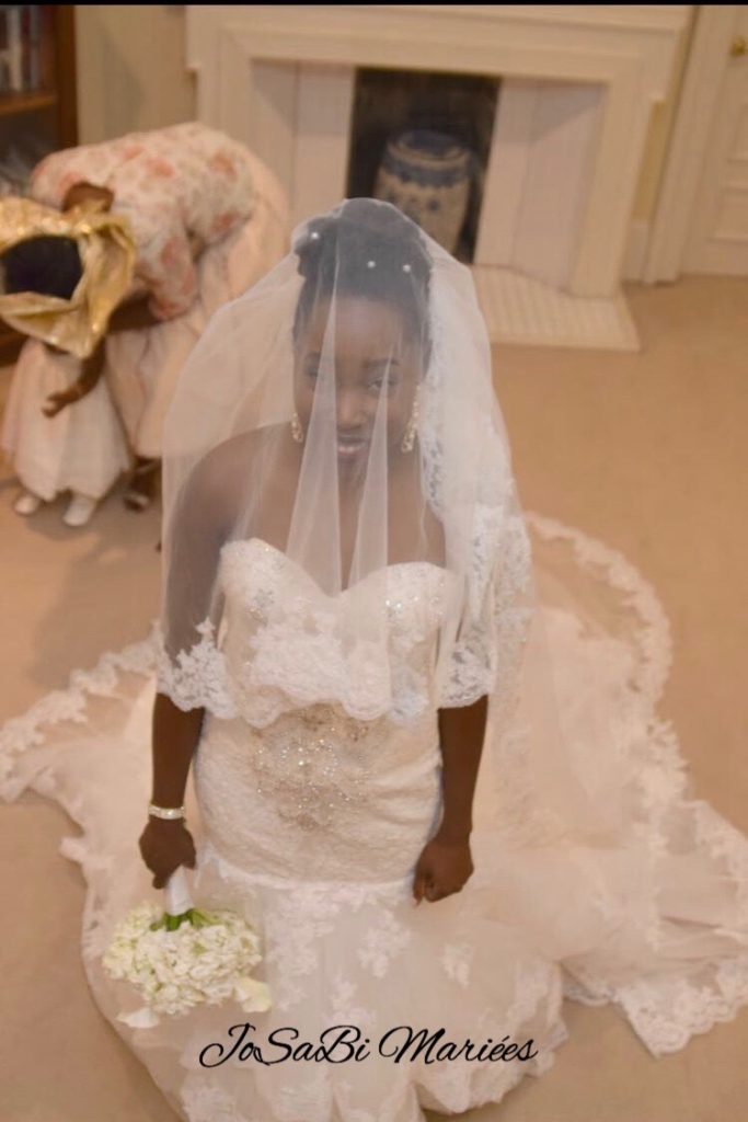 Bride Deborah smiling right before walking down the aisle