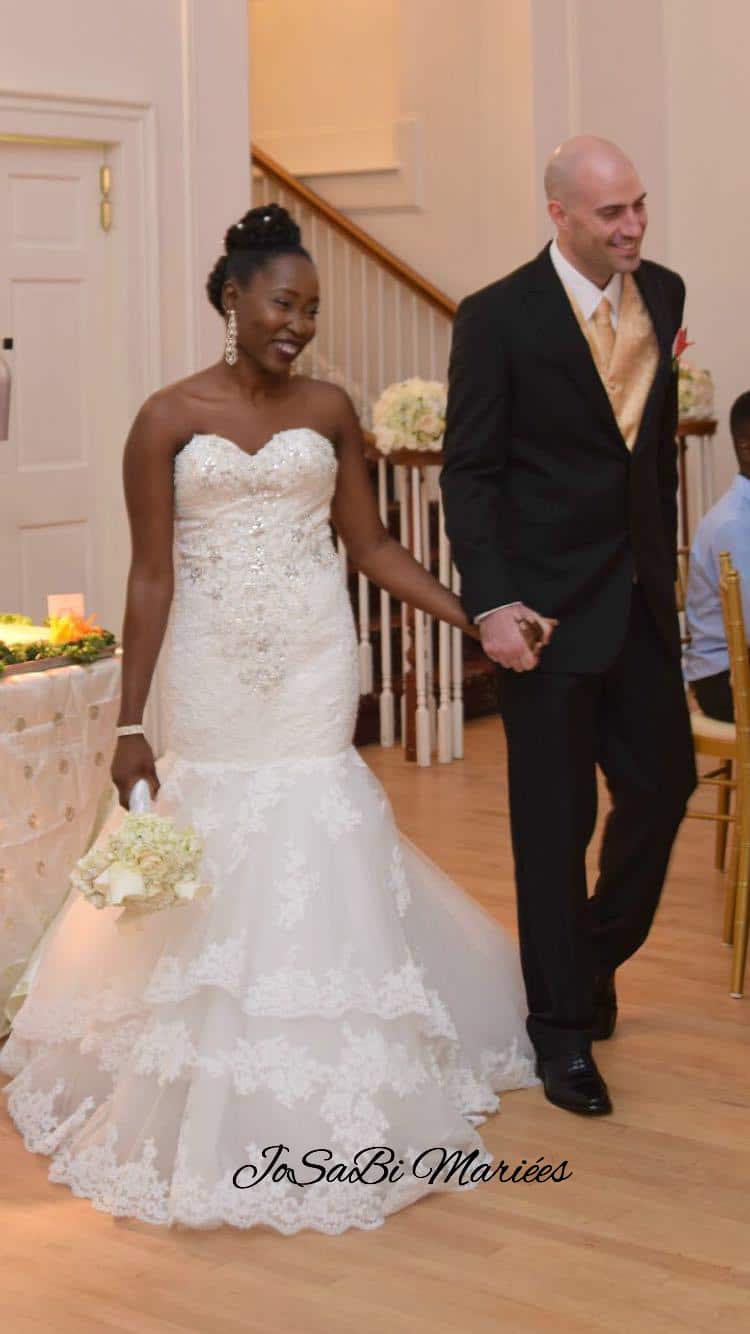 Bride Deborah smiling in her custom wedding dress by JoSaBi Mariées