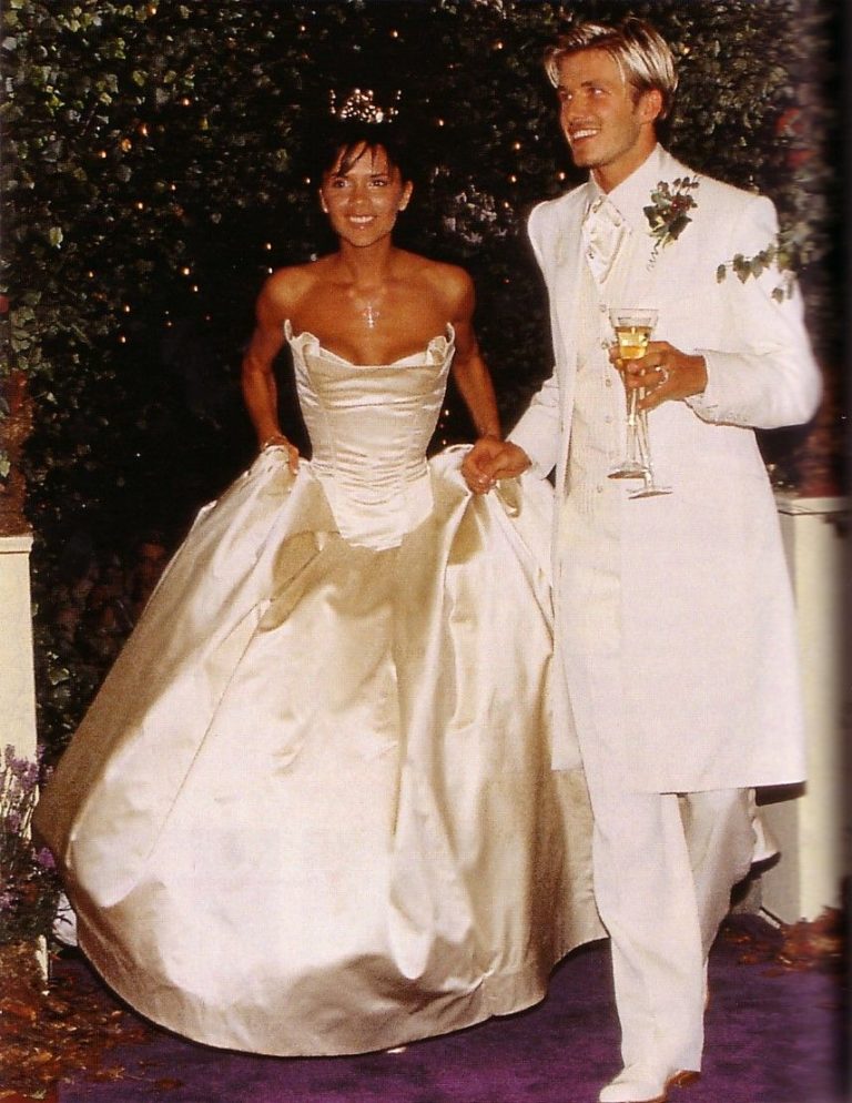 Victoria Beckham in a light champagne gown on her wedding day to David Beckham