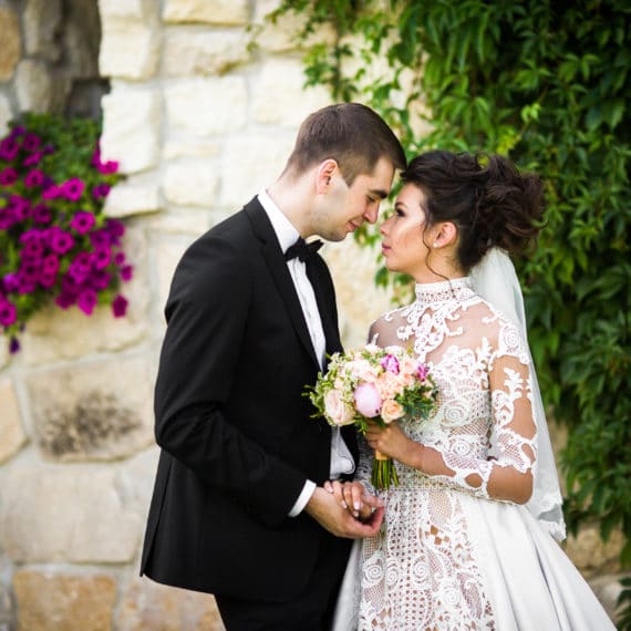 Bride wearing a high neck wedding dress on the JoSaBi dress blog