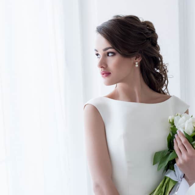 Bride in a bateau neckline wedding gown on the JoSaBi blog