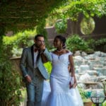 Laetitia wearing a custom JoSaBi wedding dress and her husband on their wedding day
