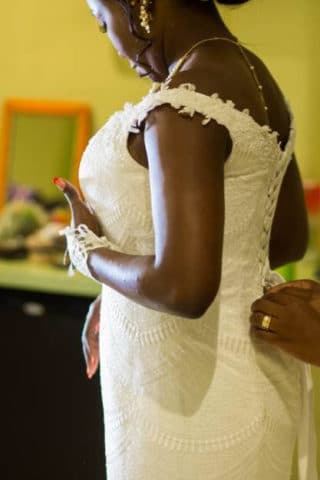 Bride Laetitia getting dressed on her wedding day