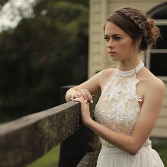 Bride wearing a halter wedding dress on the JoSaBi dress blog