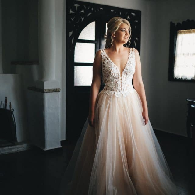 Bride in a V neck wedding gown on the JoSaBi blog