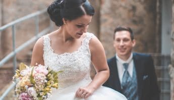 Bride with a square neckline wedding dress smiling