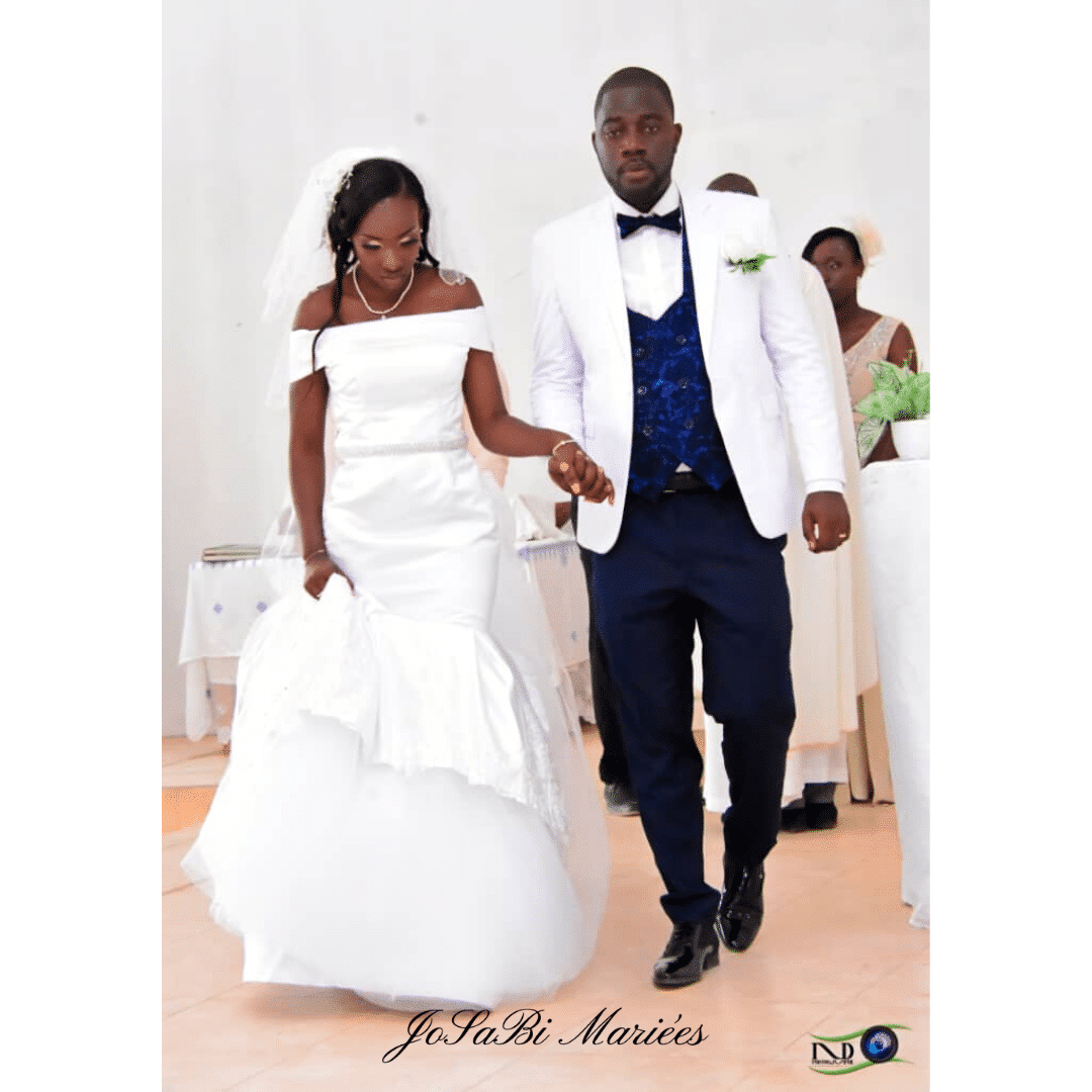 Sophie with her groom in her custom JoSaBi satin wedding dress