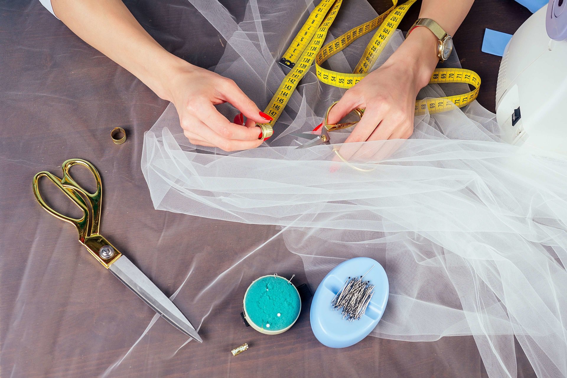 designer doing wedding gown alterations