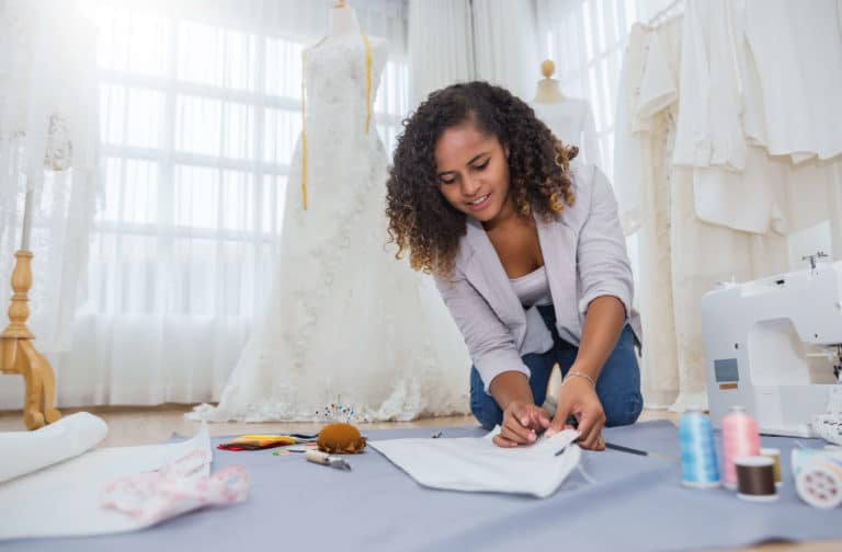 designer doing wedding dress alterations