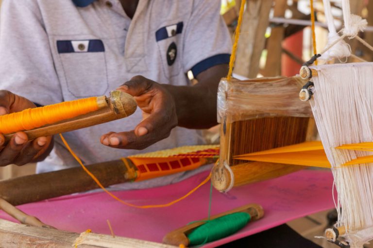 weaving african fabric kente cloth